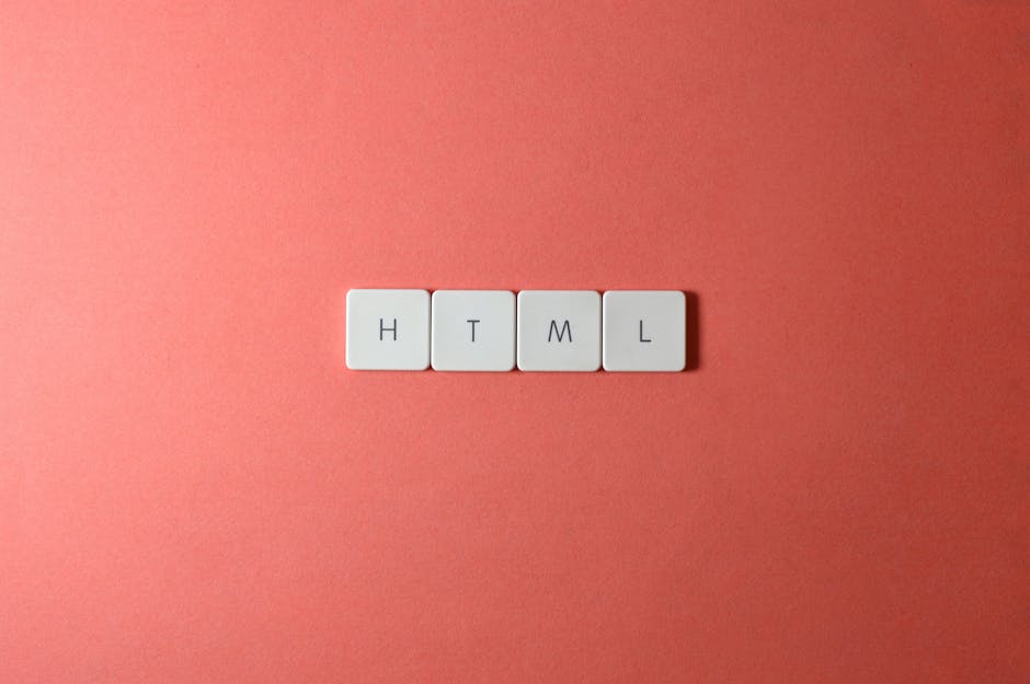 Four white keyboard keys spelling out 'HTML' are neatly aligned on a soft pink background. The keys are evenly spaced and appear clean, with black lettering clearly visible. The soft, pastel backgroun